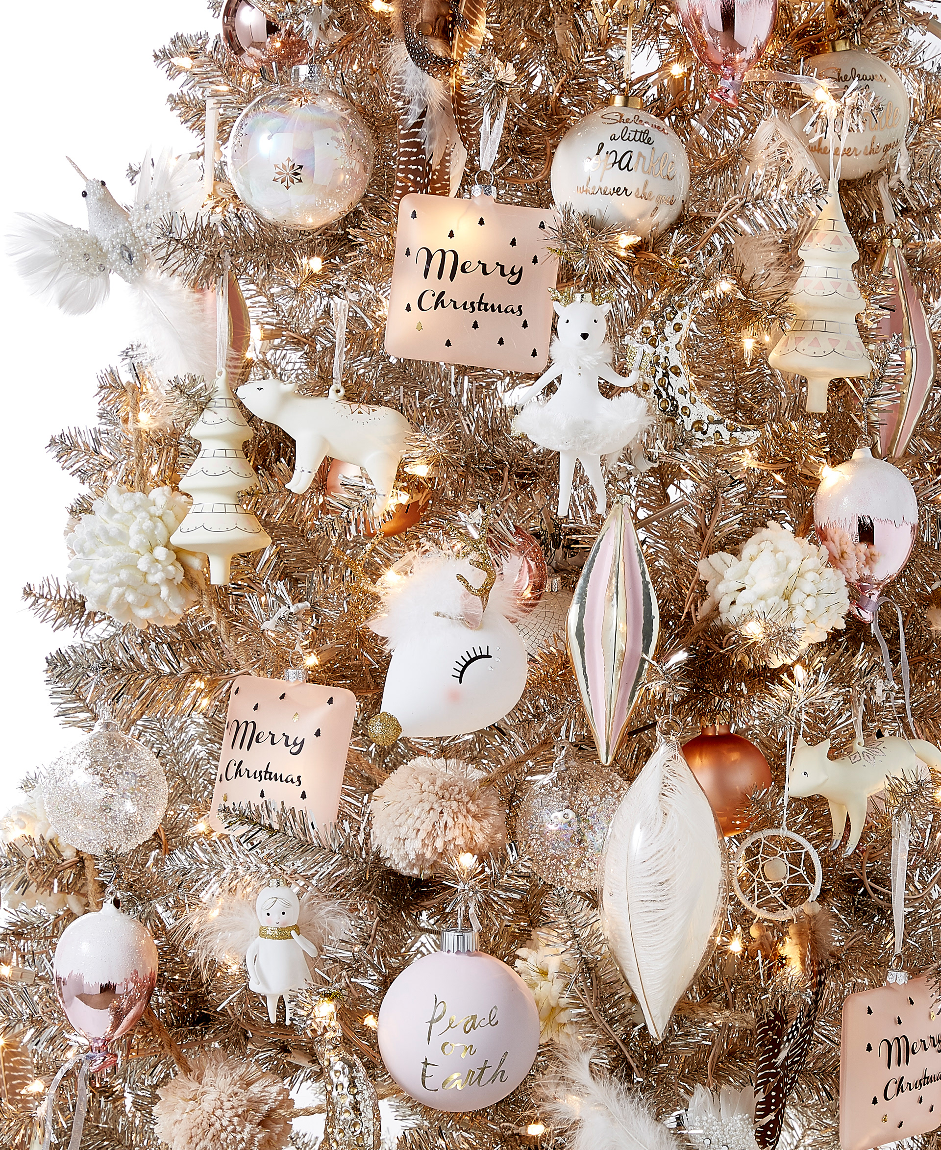 A stylish rose gold Christmas tree with pink and white ornaments