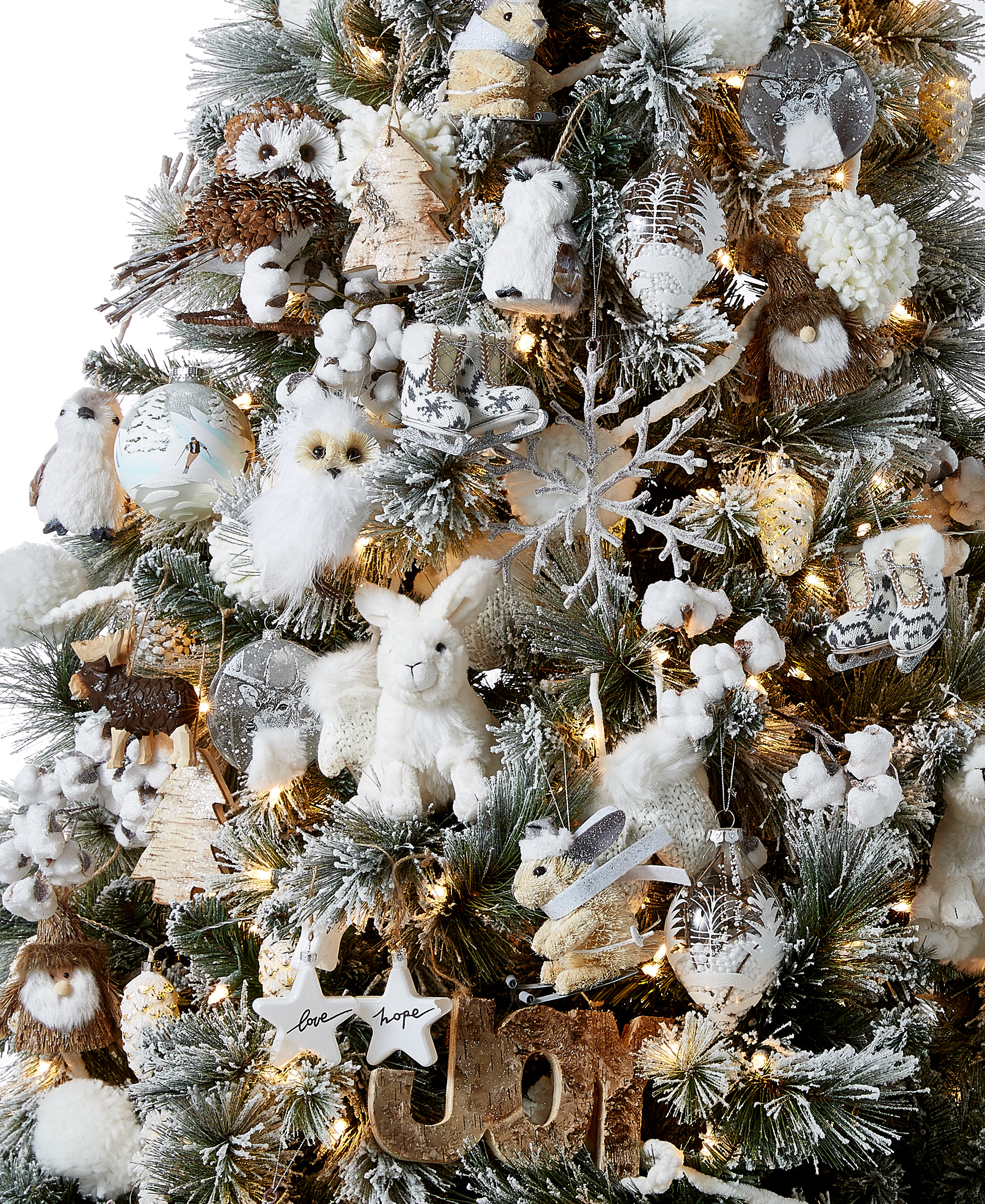 A festive Christmas tree with a white winter woodland theme