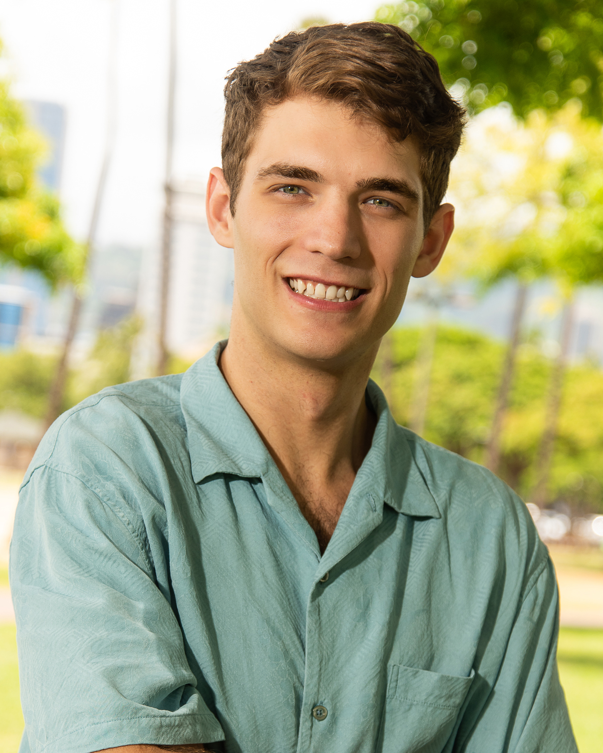 Friendly outdoor headshot of a young man