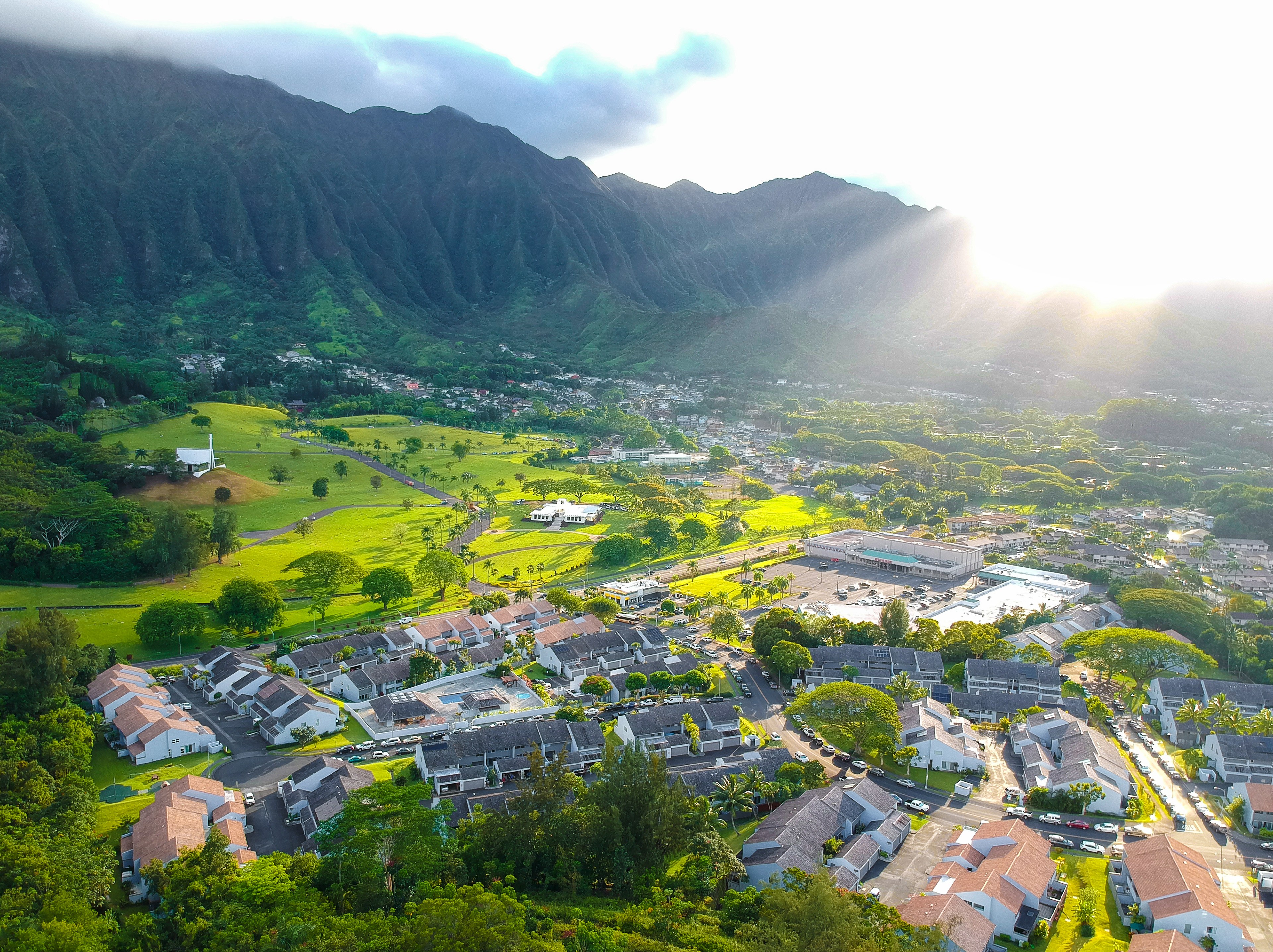 Breathtaking aerial view of a valley community with sun rays