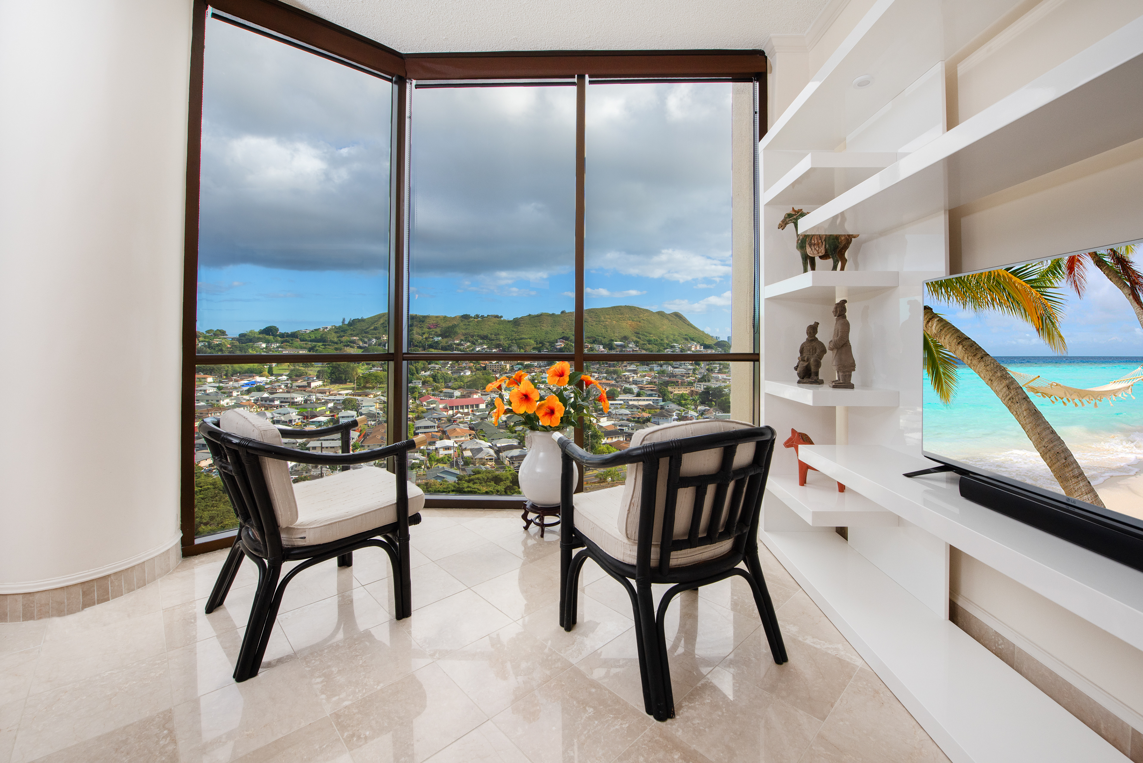 Sitting area in a high-rise apartment with a view of the valley