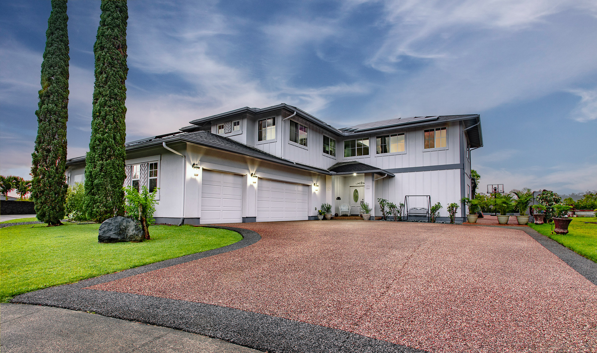 Large modern suburban house with a circular driveway