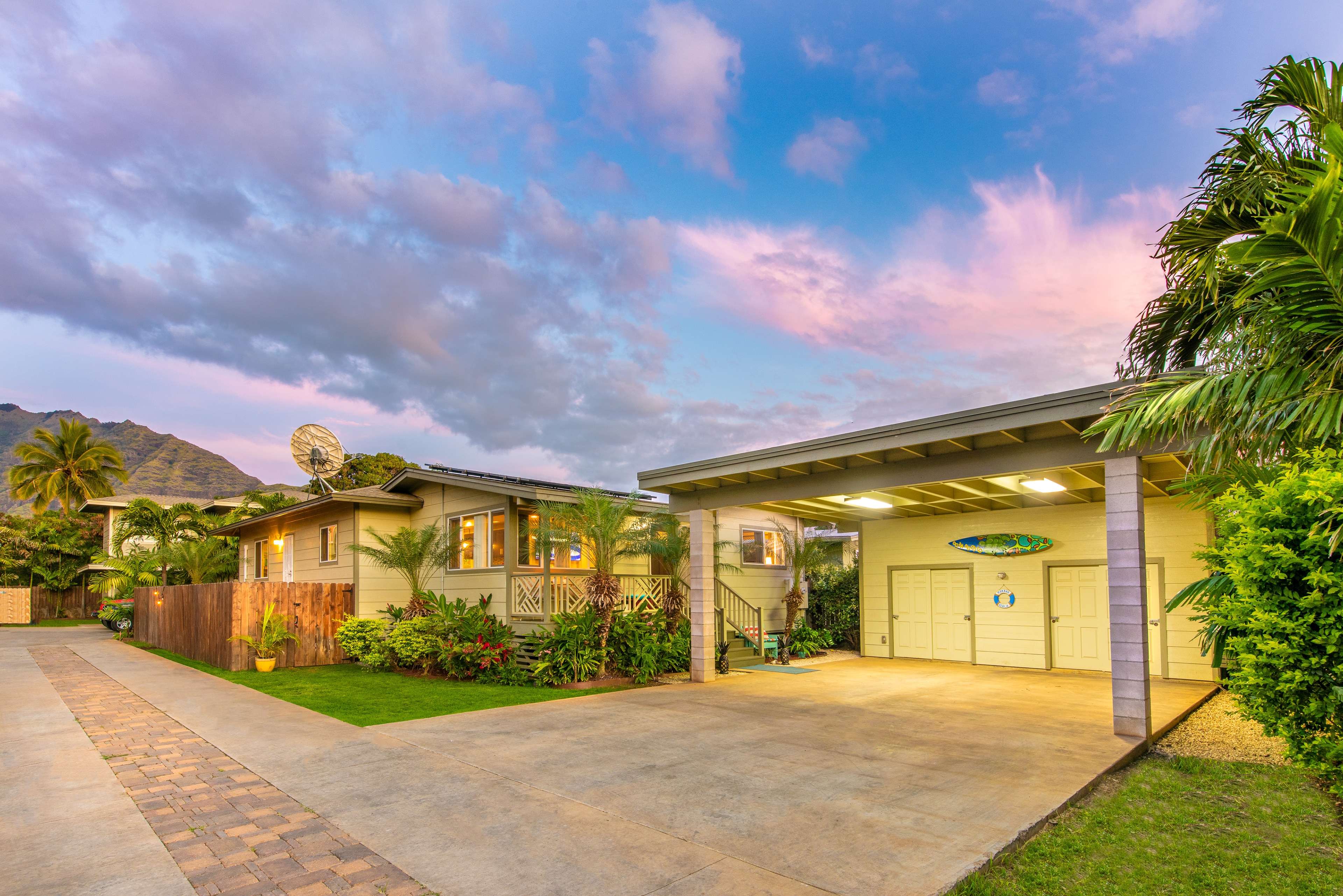 Charming suburban home with a carport at dusk